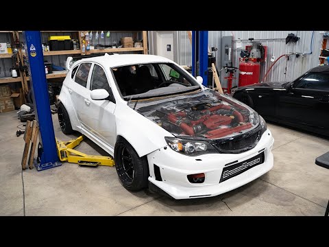 The STi Gets New Exhaust and Carbon Hatch!
