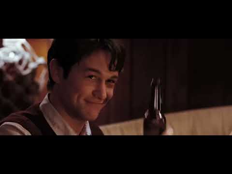 Official trailer still from (500) Days of Summer: Tom beaming through downtown after a perfect night