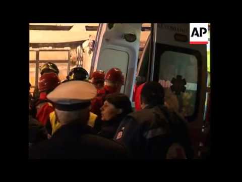 WRAP Night scenes from quake,  new tremor, tents ADDS body