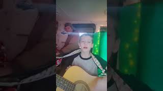 cody playing the guitar to fresh beat band great day by the fresh beat band