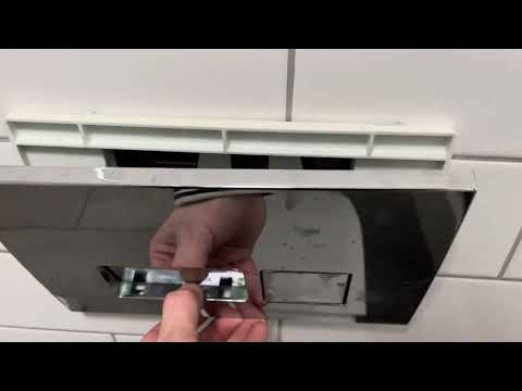 Part of a video titled How to remove a flush button to a toilet - YouTube