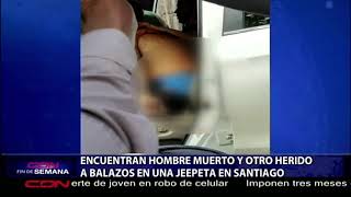 Encuentran un hombre muerto y otro herido a balazos dentro de jeepeta en Santiago