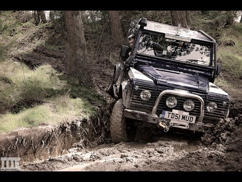 Land Rovers Driving through a Logging Forest in Wales with Accident