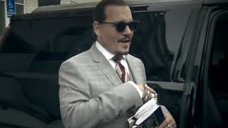 Johnny Depp leaving court today listening to Bob Marley / original