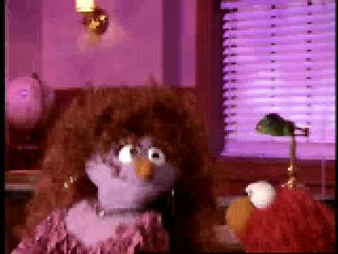Glenys Vargas sings with Elmo on Sesame Street