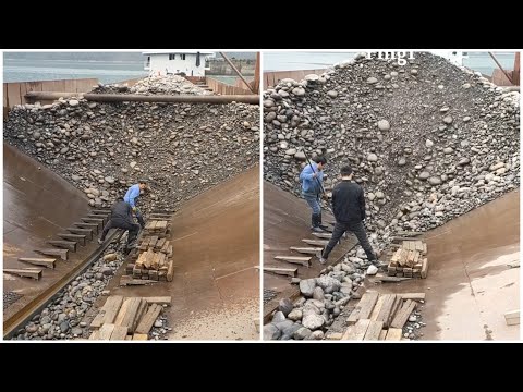 Barge unloads 3900 tons of cobblestone.  Satisfying video