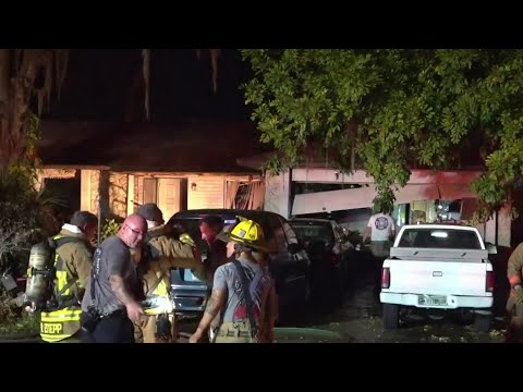 Orange County firefighters battle house fire