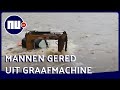 Mannen uit graafmachine gered in Chinese rivier | NU.nl