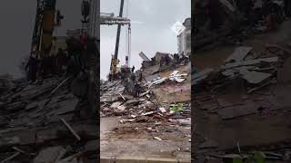 Moment building collapses in Turkey as rescuers co