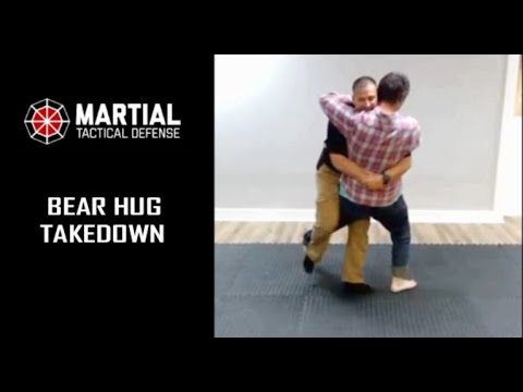 Bear hug trip takedown pin