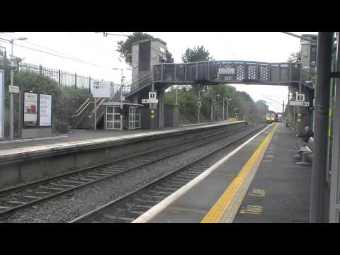 Irish Rail 8100 EMU 8124 + 8125 + 8137 departs and a 29000 DMU 290023 arrives at Portmarnock