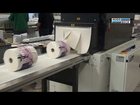 Shrink wrapping of tissue rolls in printed film