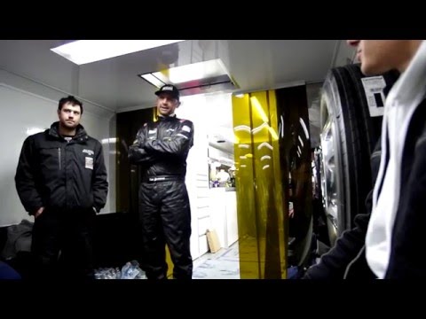 Professional endurance racers discussing an FCM suspension setup