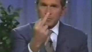 George W Bush gives one finger salute