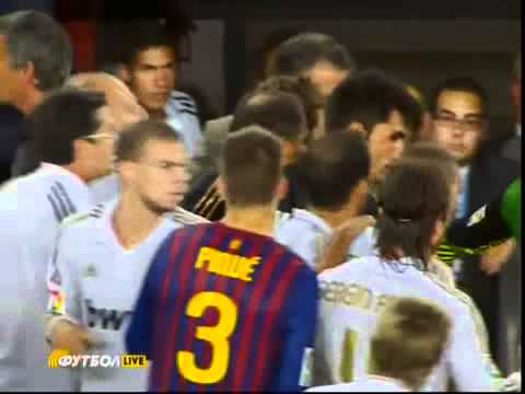 Jose Mourinho pokes the eye of Barcelona coach Tito Vilanova