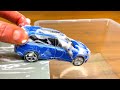 Various Diecast Model Cars Getting Washed In Water