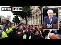 'Bye Bye Boris': Crowd boos and plays music amid UK PM's resignation