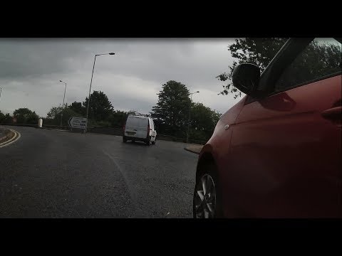 KP66 JJO - Squeezes past cyclists on roundabout, gets a slap on the rear door.