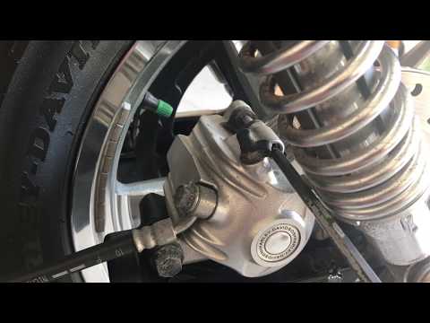 Harley Davidson Sportster rear brake pads installed.