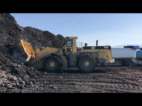 Caterpillar 988F Wheel Loader Loading Coal On Trucks