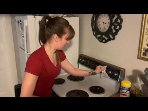 Cleaning the Stove with Clorox Wipe
