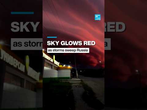 Sky glows red as storms sweep Russia