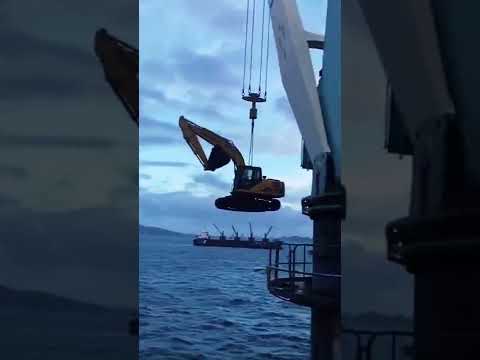 The crane transports the excavator