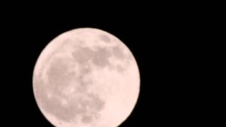 Full moon rising on March 16, 2014, in Tokyo, Japan.