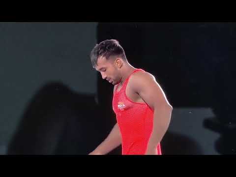 India's Naveen enters the quarterfinal of the men's freestyle wrestling 74kg category