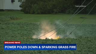 Downed power poles appear to spark small grass fire in Oswego, Illinois - August 2026