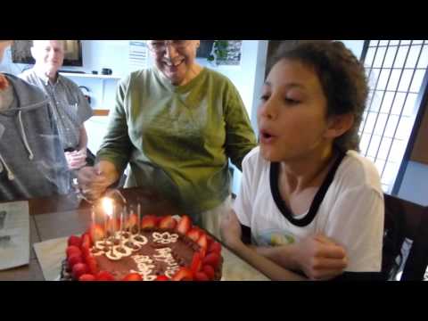 Julia blowing out the candles on birthday cake that Raman and Anna made 04/12/2015