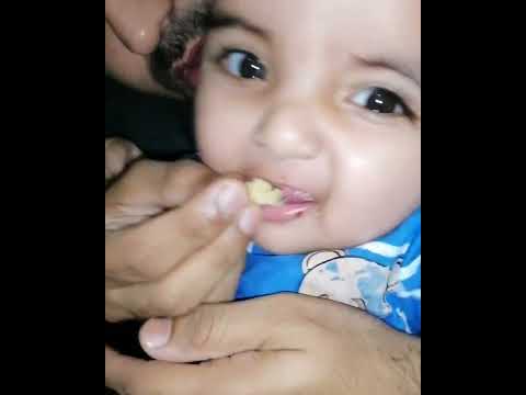 Arish Hassan 08 February 2020 age 06 Month. Eating Orang & cake