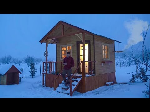 Camping During a Snowstorm, Rain, and Wind in a Wooden House