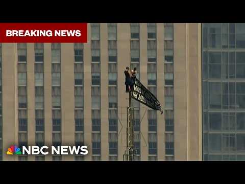 BREAKING: Trespassers climb to the top of the Empire State Building spire