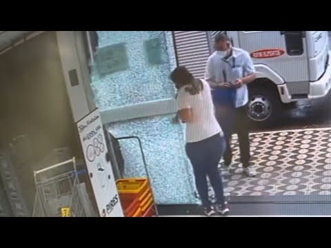 Woman Accidentally Shatters Store's Glass Door