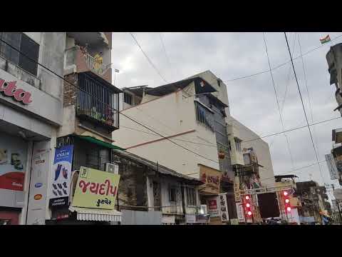 Pouring of water from building during Dahi Handi procession in Valsad MG Road