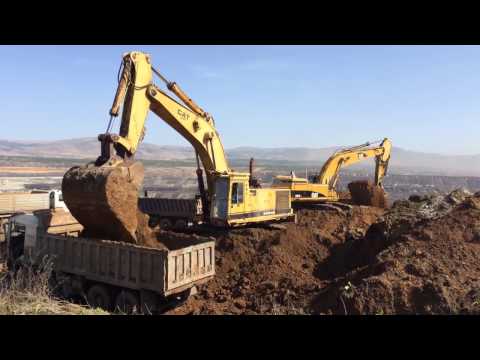 Caterpillar 365CL And 245B Excavators Loading Trucks