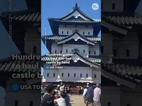 Hundreds of volunteers gather in Japan to haul 400-ton castle by hand