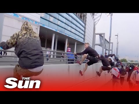 Ticketless fans rush Wembley Stadium security barriers at England vs Italy Euro 2020 final
