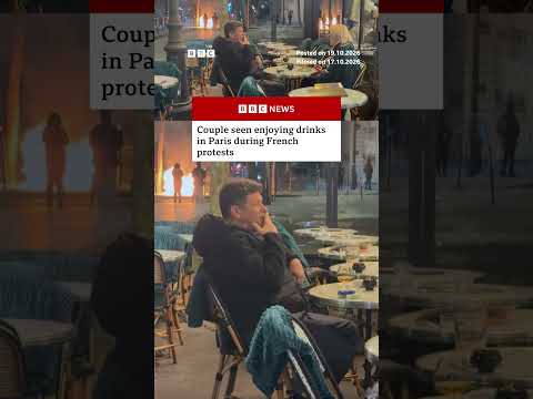 Couple seen enjoying drinks in Paris during French protests. #Paris #France #BBCNews