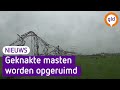 Door storm verwoeste hoogspanningsmasten worden weggehaald