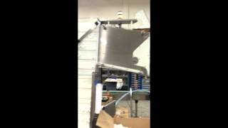 Waterfall cap feeder with kicking cam