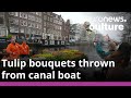 Tulip Season Begins In Amsterdam With Bouquets Thrown From Canal Boat