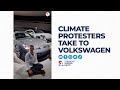 Climate activists target Volkswagen, glue hands to facility floor