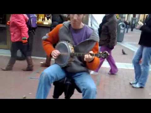 Man Playing Guitar with Feet - and Banjo with Hands