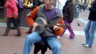 Man Playing Guitar with Feet - and Banjo with Hands