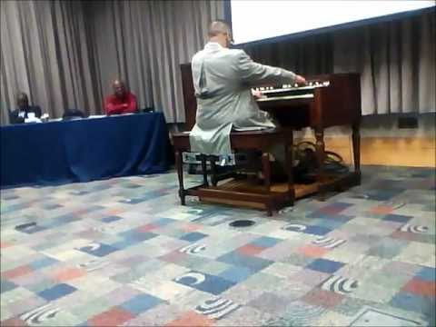 Pastor Curtis Daniel on organ at AIM 2012