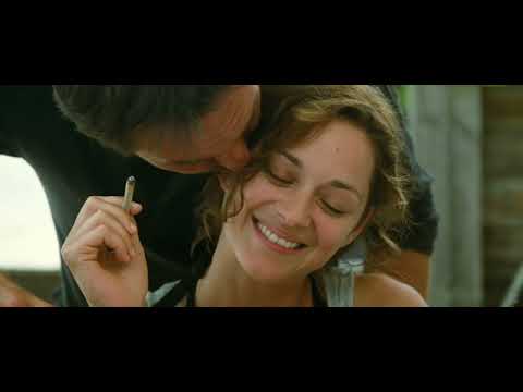 Trailer montage: friends at a timber table with wine; a cut to the Atlantic; an acoustic guitar figure hanging over the image