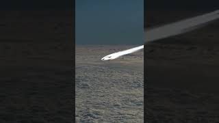 The video of a Boeing 747 flying through the sky, taken from the cockpit of a nearby plane