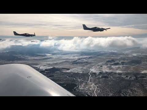 Lancairs flying formation over the Utah desert